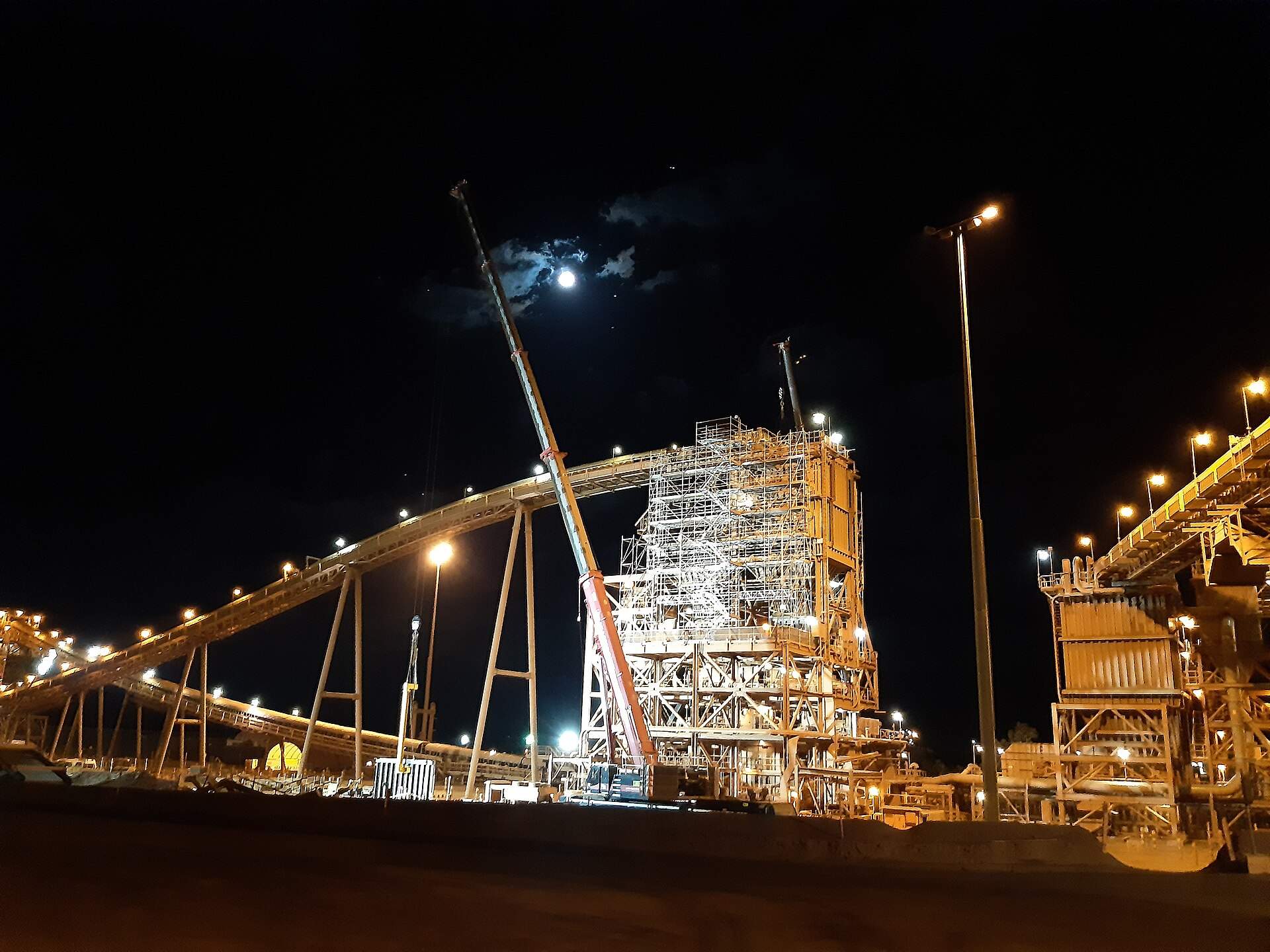 The Brockman 4 secondary crusher building covered in scaffolding at night, Pilbara, WA